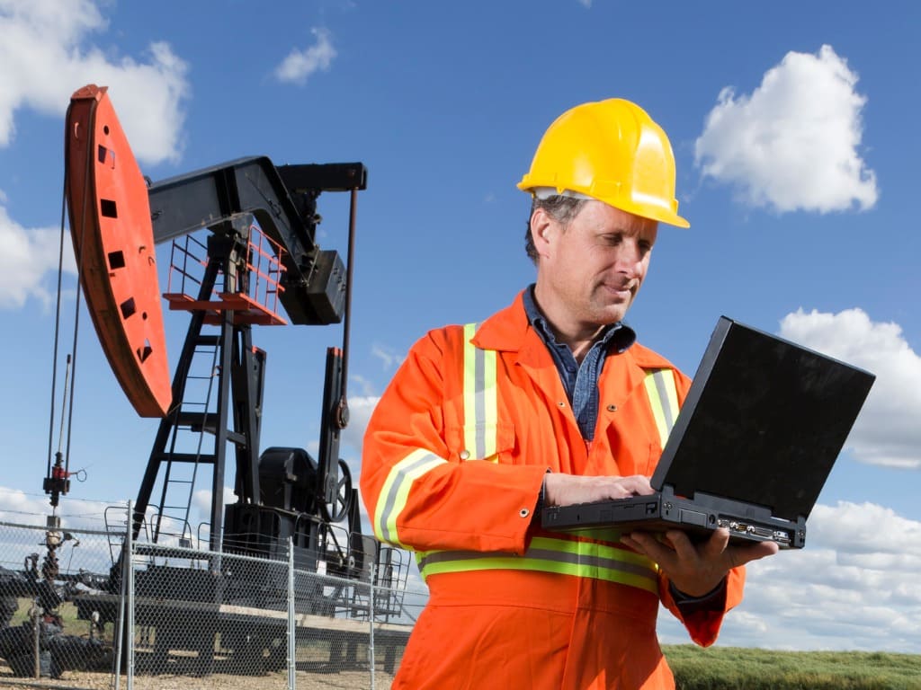 oil worker and robust laptop